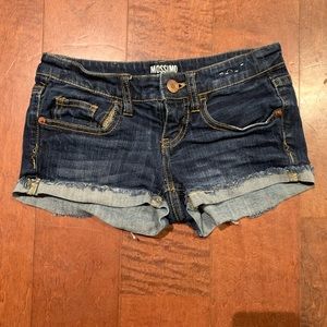 Dark wash jean shorts.